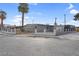 The property has a fenced front yard, secure gate, and off-street parking at 2801 Emmons Ave, North Las Vegas, NV 89030