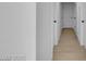 Bright hallway featuring a smooth transition between rooms with stylish light-colored flooring at 2801 Emmons Ave, North Las Vegas, NV 89030