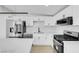 Modern kitchen featuring stainless steel appliances, sleek countertops, and ample cabinet space at 2801 Emmons Ave, North Las Vegas, NV 89030