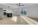 Open-concept living room, stainless steel appliances, and sliding door access to a pool at 2801 Emmons Ave, North Las Vegas, NV 89030