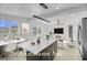 Bright, open-concept living space features a modern kitchen, dining area, and stylish living room at 2801 Emmons Ave, North Las Vegas, NV 89030