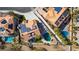 Aerial view of a backyard with a pool, spa, patio area, solar panels, and desert landscaping at 3924 Diamond Ridge St, Las Vegas, NV 89129