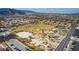 Aerial view of community amenities including basketball court, park, playground, tennis courts, and green space at 3924 Diamond Ridge St, Las Vegas, NV 89129