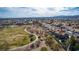 Expansive aerial view of a residential area adjacent to a large park and green space at 3924 Diamond Ridge St, Las Vegas, NV 89129