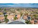 Aerial view of the community showcasing the roofs, landscaping, and the surrounding area with mountains at 3924 Diamond Ridge St, Las Vegas, NV 89129