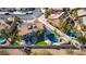 Aerial view of backyard featuring a private pool, spa, lush landscaping, and a patio area at 3924 Diamond Ridge St, Las Vegas, NV 89129