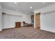 Spacious bedroom with stone fireplace, plush carpet, closet with shelving, and seating area at 3924 Diamond Ridge St, Las Vegas, NV 89129