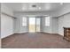 Bright bedroom featuring plush carpet, a closet with shelving, and an open view to the balcony at 3924 Diamond Ridge St, Las Vegas, NV 89129