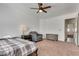 Comfortable bedroom with carpet, window, ceiling fan, and sitting chair at 3924 Diamond Ridge St, Las Vegas, NV 89129