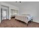 Comfortable bedroom with neutral carpet, closet with sliding mirror doors, and a bright interior at 3924 Diamond Ridge St, Las Vegas, NV 89129