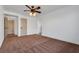 Bright bedroom with a ceiling fan, plush carpeting, and neutral walls at 3924 Diamond Ridge St, Las Vegas, NV 89129