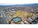 Community aerial view showcasing amenities like tennis courts, a playground, and green spaces for active living at 3924 Diamond Ridge St, Las Vegas, NV 89129