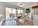 Bright dining room with outdoor access and seating for six at 3924 Diamond Ridge St, Las Vegas, NV 89129