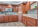 Kitchen with wood cabinets, stainless steel appliances, and wood-look floors at 3924 Diamond Ridge St, Las Vegas, NV 89129