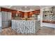 Kitchen island with stylish backsplash, stainless steel appliances and wood look flooring at 3924 Diamond Ridge St, Las Vegas, NV 89129