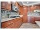 Kitchen with stainless steel appliances, wood cabinets, and modern finishes at 3924 Diamond Ridge St, Las Vegas, NV 89129