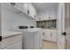 Functional laundry room with modern appliances and ample storage space at 3924 Diamond Ridge St, Las Vegas, NV 89129