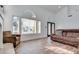 Bright living room with large windows, wood-look floors, and stylish furniture at 3924 Diamond Ridge St, Las Vegas, NV 89129