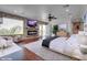Spacious main bedroom features a stone accent wall with fireplace and private balcony access at 3924 Diamond Ridge St, Las Vegas, NV 89129