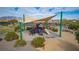 Colorful community playground featuring slides, climbing structures, and a shaded seating area at 3924 Diamond Ridge St, Las Vegas, NV 89129