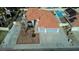 Aerial view of a home with a tile roof, desert landscaping and a swimming pool at 4117 Sinew Ct, Las Vegas, NV 89129