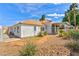 Backyard showcasing a covered patio, lush landscaping, and well-maintained desert yard at 4117 Sinew Ct, Las Vegas, NV 89129