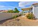 Lush backyard with a covered patio, providing a serene outdoor space for relaxation and entertaining at 4117 Sinew Ct, Las Vegas, NV 89129