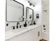 Elegant bathroom with double sinks, modern fixtures, and a tub with shower at 4117 Sinew Ct, Las Vegas, NV 89129