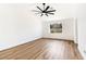 Light-filled bedroom with wood flooring and a large window at 4117 Sinew Ct, Las Vegas, NV 89129