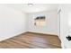 Simple bedroom featuring wood floors, a single window, and white trim at 4117 Sinew Ct, Las Vegas, NV 89129