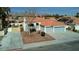 Aerial view of home with desert landscaping, tile roof and two car garage at 4117 Sinew Ct, Las Vegas, NV 89129