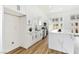 White kitchen with stainless appliances, modern cabinetry, and large island at 4117 Sinew Ct, Las Vegas, NV 89129