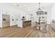 Bright eat-in kitchen features an island with bar seating, stainless appliances, and modern chandelier at 4117 Sinew Ct, Las Vegas, NV 89129