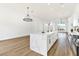 White kitchen with island and stainless steel appliances at 4117 Sinew Ct, Las Vegas, NV 89129