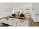 Open living area showcases wood floors, white walls, and a modern kitchen at 4117 Sinew Ct, Las Vegas, NV 89129