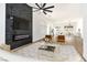 Open-concept living area with black marble fireplace and stylish furnishings at 4117 Sinew Ct, Las Vegas, NV 89129