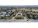 Aerial view showcases the community's impressive amenities, including tennis courts, a golf course, and lush landscaping at 42 Gulf Stream Ct, Las Vegas, NV 89113