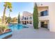 Spacious backyard with a beautiful pool and spa, complemented by elegant architecture at 42 Gulf Stream Ct, Las Vegas, NV 89113