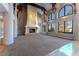 Spacious living room featuring a fireplace, high ceilings, large windows, and elegant architectural details at 42 Gulf Stream Ct, Las Vegas, NV 89113