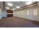 Expansive living room with wooden trim, neutral carpet, and built-in wet bar offers a versatile space at 42 Gulf Stream Ct, Las Vegas, NV 89113