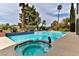 Backyard pool, spa, and waterfall feature a classic design, creating a tranquil outdoor oasis at 42 Gulf Stream Ct, Las Vegas, NV 89113