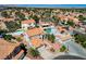 Aerial view of a neighborhood featuring desert landscaping, tile roofs, and tree lined streets at 5 Tarryall Ter, Henderson, NV 89074