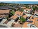 Aerial view of a property featuring a tile roof, two-car garage, and private backyard at 5 Tarryall Ter, Henderson, NV 89074