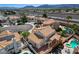 The property has a tile roof, gravel landscaping, and a covered patio, creating an inviting outdoor space at 5 Tarryall Ter, Henderson, NV 89074