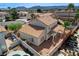 Spacious backyard featuring gravel landscaping, a covered patio, and a refreshing in-ground pool at 5 Tarryall Ter, Henderson, NV 89074