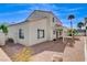 This house features a cozy backyard with a covered patio and gravel, ideal for desert living at 5 Tarryall Ter, Henderson, NV 89074