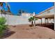 Private backyard featuring desert landscaping, stone accents, and a covered patio at 5 Tarryall Ter, Henderson, NV 89074