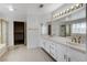 Bright bathroom features double sinks with ample counter space and tiled floors at 5 Tarryall Ter, Henderson, NV 89074
