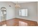 Bright dining room features hardwood floors, a chandelier, and a large window with natural light at 5 Tarryall Ter, Henderson, NV 89074