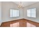 Charming dining room with hardwood floors and a chandelier, offering a classic and inviting ambiance at 5 Tarryall Ter, Henderson, NV 89074